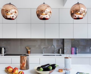A Modern Kitchen Decor with Copper Lamps and Vintage Details