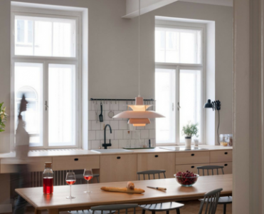 Wooden House Shines with Contemporary Light Fixture